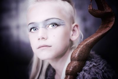 Close-up portrait of boy looking away