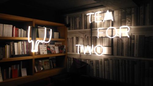 Illuminated lights on shelf at home