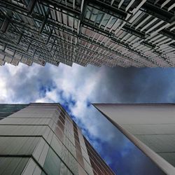 Low angle view of building against cloudy sky