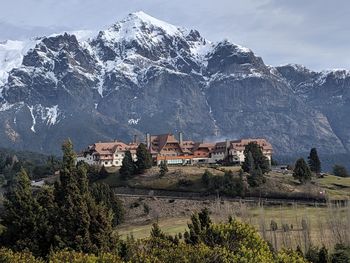 Buildings against mountain range