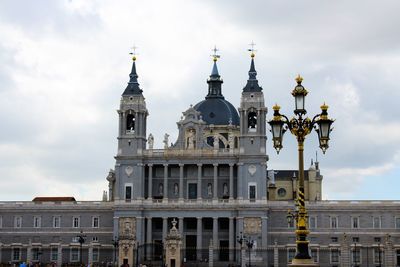 Low angle view of palace against cloudy sky