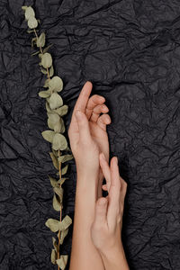 Cropped hand of woman with henna tattoo