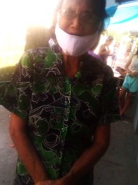 Portrait of woman standing outdoors