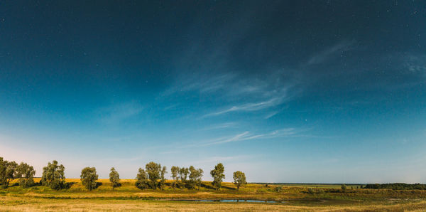 Scenic view of field against sky at night