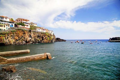 Scenic view of sea against cloudy sky