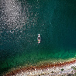 High angle view of boat on shore line