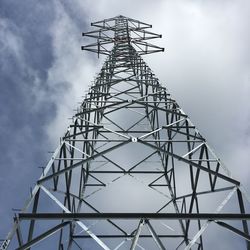 Low angle view of communications tower against sky