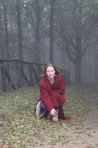 Portrait of woman in forest during winter