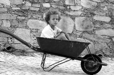 Portrait of boy sitting on chair