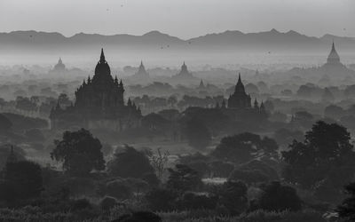 Aerial view of temple against sky during sunset