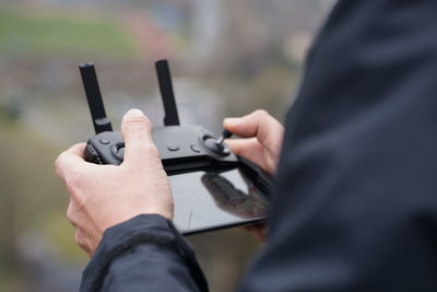 Close-up of man holding camera