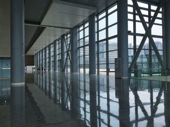 Columns reflecting on floor at china national convention center