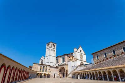 Low angle view of historical building against blue sky