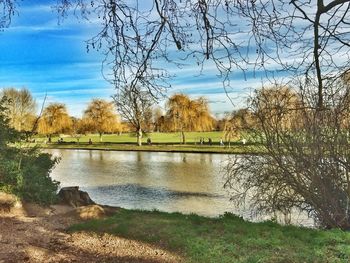 Scenic view of lake against cloudy sky