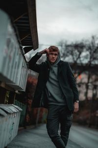 Full length of young man looking at camera