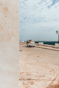 View of wall by sea against sky