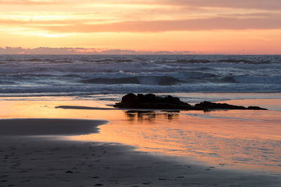Scenic view of sea against sky during sunset