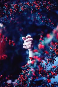 Person standing by tree