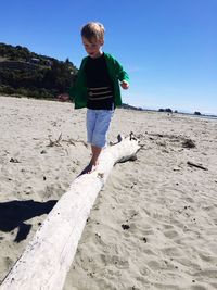 Full length rear view of man on beach