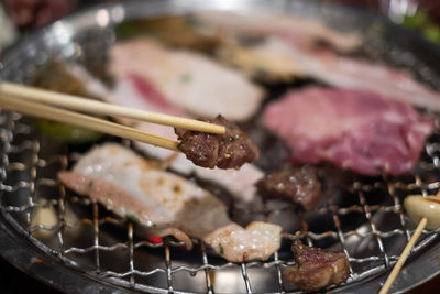 Close-up of meat on barbecue grill