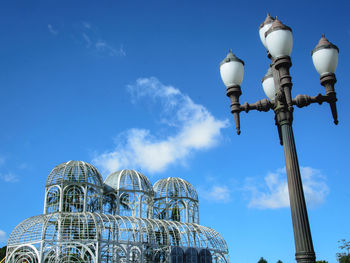 Low angle view of street light against building