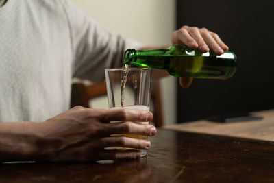 Midsection of man working on table