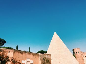 Low angle view of historical building against blue sky