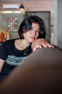 Portrait of young woman looking away