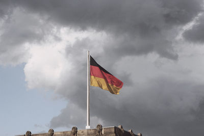 Low angle view of flag against sky