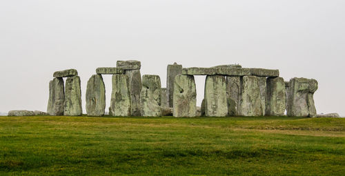 Built structure on field against clear sky