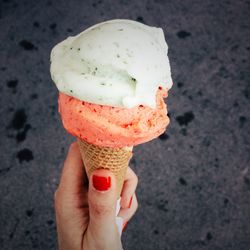 Cropped hand holding ice cream cone