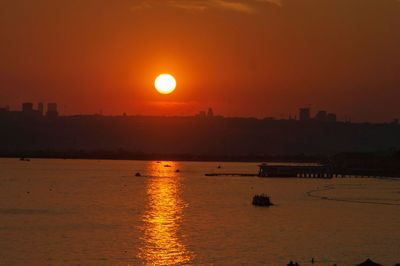 Scenic view of sea against sky during sunset