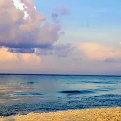 Scenic view of sea against sky at sunset