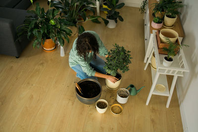 High angle view of woman sitting on table