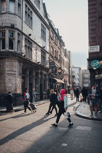 People walking on city street