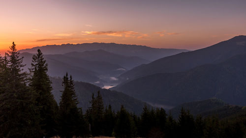 Scenic view of mountains against sky during sunset