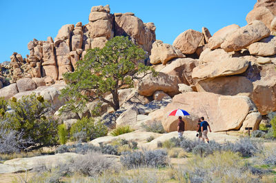 People on rock formation