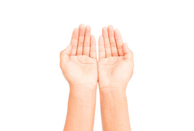 Close-up of human hand against white background