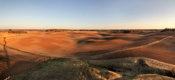 Scenic view of desert against clear sky