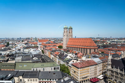 High angle view of townscape against blue sky