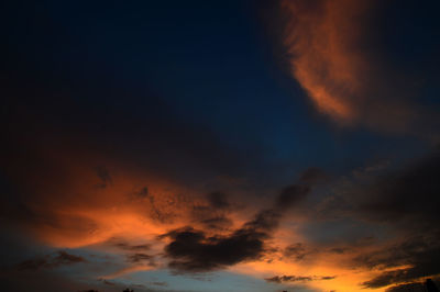 Low angle view of dramatic sky at sunset