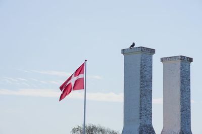 Low angle view of flag against sky