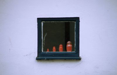 Close-up of russian doll in window 