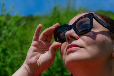 Close-up of woman wearing sunglasses