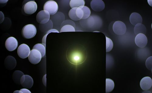 Defocused image of illuminated lights at night