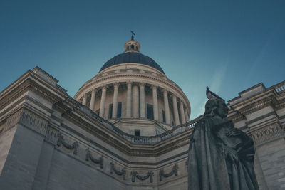 Low angle view of statue of building against sky