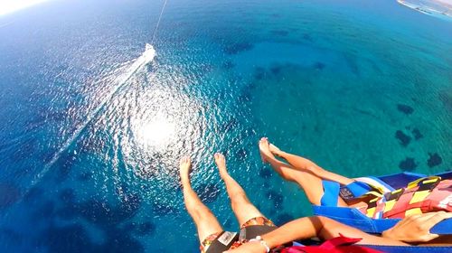 High angle view of people swimming in sea