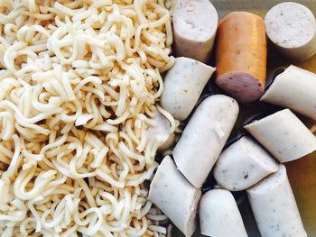 Close-up of noodles and sausages