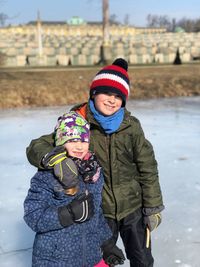 Happy boy standing in snow