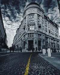 View of street against cloudy sky